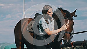 Happy Woman Stroking a Horse on a Farm in Nature at Summer Day, Slow Motion