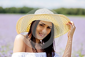 Happy woman in summer field. Young girl relax outdoors. Freedom concept.