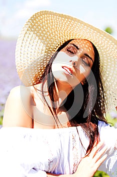 Happy woman in summer field. Young girl relax outdoors. Freedom concept.