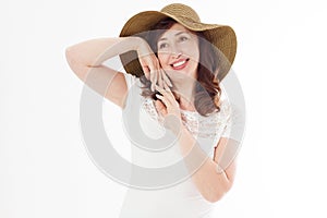 Happy woman in summer hat isolated on white background. Sun protection skin care and vacation holidays concept. Middle age female