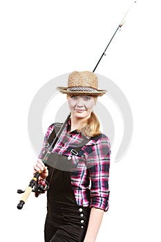 Happy woman in sun hat holding fishing rod