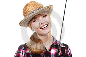 Happy woman in sun hat holding fishing rod