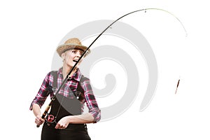 Happy woman in sun hat holding fishing rod