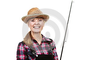 Happy woman in sun hat holding fishing rod