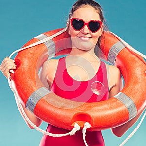 Happy woman in sunglasses with ring buoy lifebuoy.