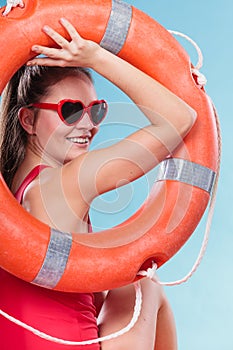 Happy woman in sunglasses with ring buoy lifebuoy.