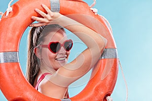 Happy woman in sunglasses with ring buoy lifebuoy.