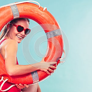 Happy woman in sunglasses with ring buoy lifebuoy.