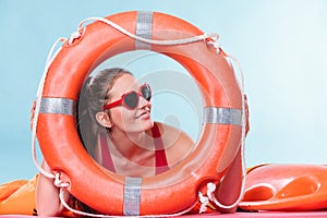 Happy woman in sunglasses with ring buoy lifebuoy.