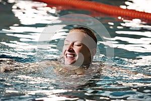 Happy woman in swimming pool