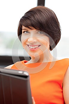 Happy woman with tablet pc computer