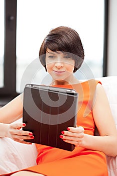 Happy woman with tablet pc computer