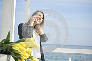 Happy woman talking on the phone