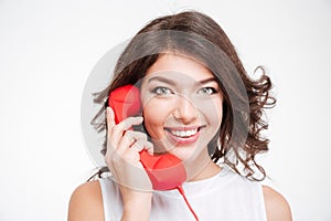 Happy woman talking on the phone tube