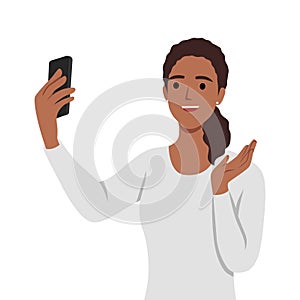 Happy woman talking video call on smartphone and waving with hand