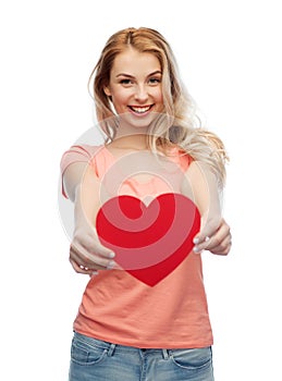 Happy woman or teen girl with red heart shape