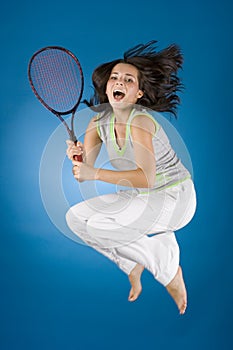 Happy woman with tennis racket