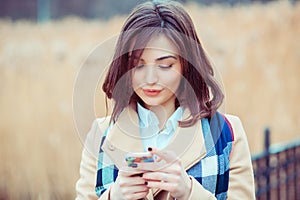 Happy woman texting sending sms