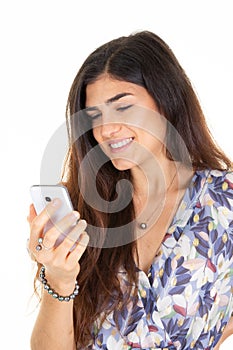 happy woman texting smartphone brunette hair standing on white background with mobile phone in hand