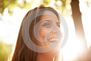 Happy woman, thinking or park with smile in nature on holiday vacation in summer for freedom. Garden, sunshine or calm