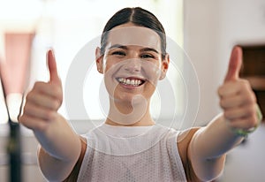 Happy woman, thumbs up portrait and gym fitness of a young female with happiness from exercise. Workout, sport and