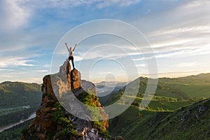 Happy woman on top mountain