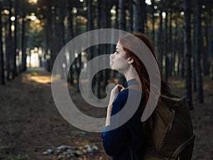 Happy woman tourist with backpack vacation nature fresh air and forest