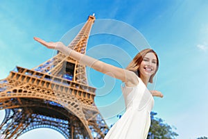 Happy woman tourist in Paris