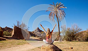 Happy woman tourist in Tafraoute famous site in Morocco