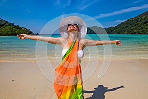 Happy woman on tropical beach