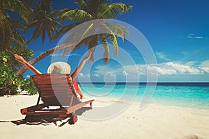 Happy woman on tropical beach vacation