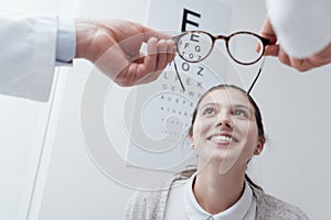 Happy woman trying her new glasses