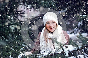 Happy woman under snowfall