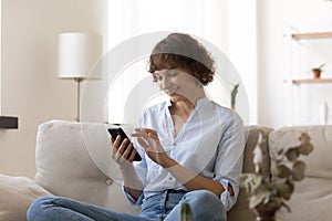 Happy woman use cellphone shopping online from home