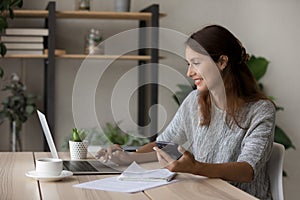 Happy woman use laptop study online from home