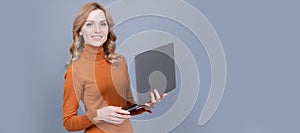 Happy woman use portable personal computer browsing online grey background, laptop. Woman portrait, isolated header