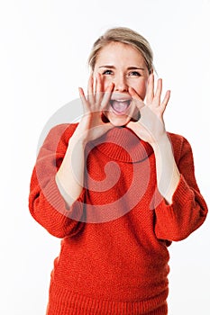 Happy woman using hands as megaphone to communicate