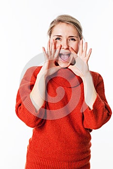 Happy woman using hands as megaphone to communicate photo