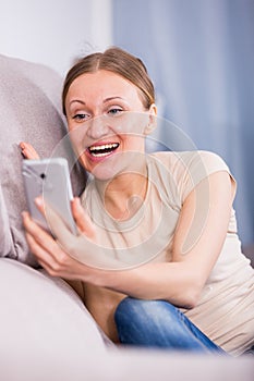 Happy woman using smartphone