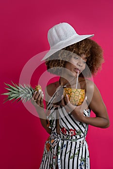 Happy woman on vacation and summer actitud , modelo african american curly hair with tropical outfit photo