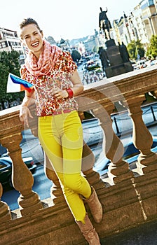 Happy woman on Vaclavske namesti in Prague with Czech flag