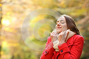 Happy woman warmly clothed in autumn