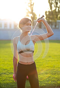 Happy woman warms up before running