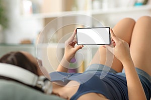 Happy woman watching media on phone showing screen mock up