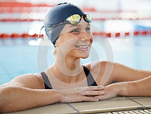 Happy, woman in water and swimming pool for competition, training or professional sports or exercise in gym or club