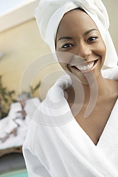 Happy Woman Wearing Bathrobe In Dayspa