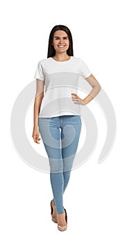 Happy woman wearing stylish light blue jeans and high heels shoes on white background