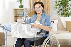 Happy woman in wheelchair iron
