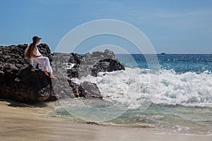 Happy  woman in white dress on tropical beach vacation