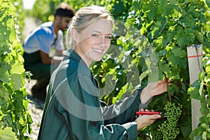 happy woman worker in vineyard